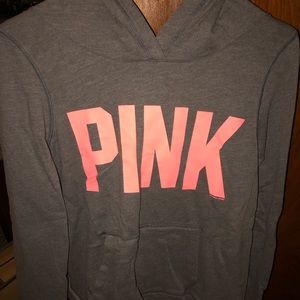 Gray sweatshirt with PINK in coral lettering